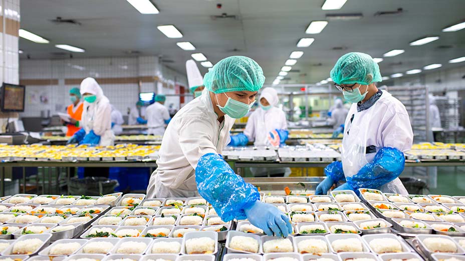Workers preparing food for an aeroplane