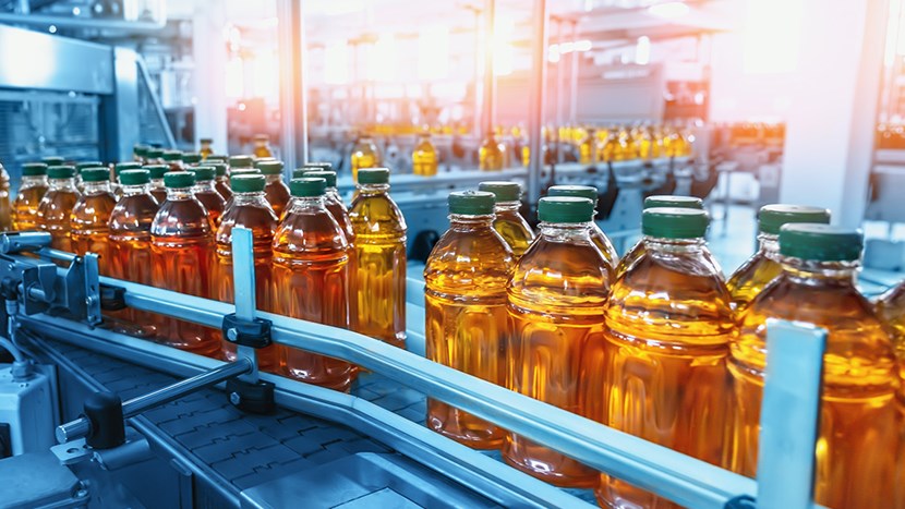 Conveyor belt with juice in bottles
