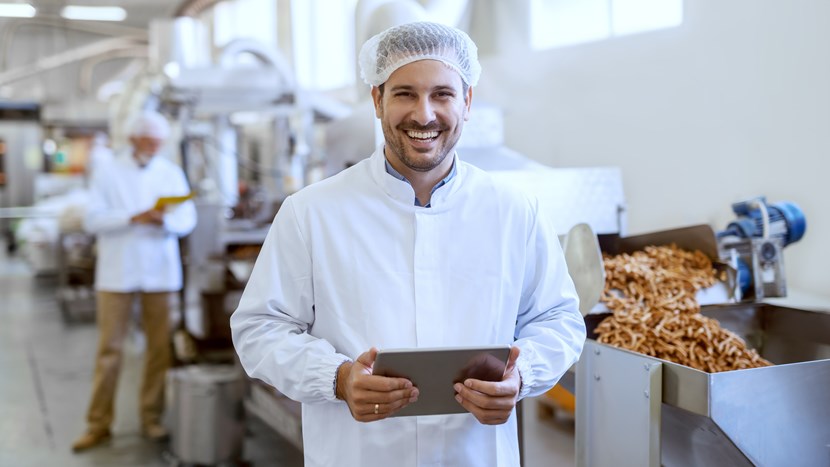 manager in sterile uniform in food factory