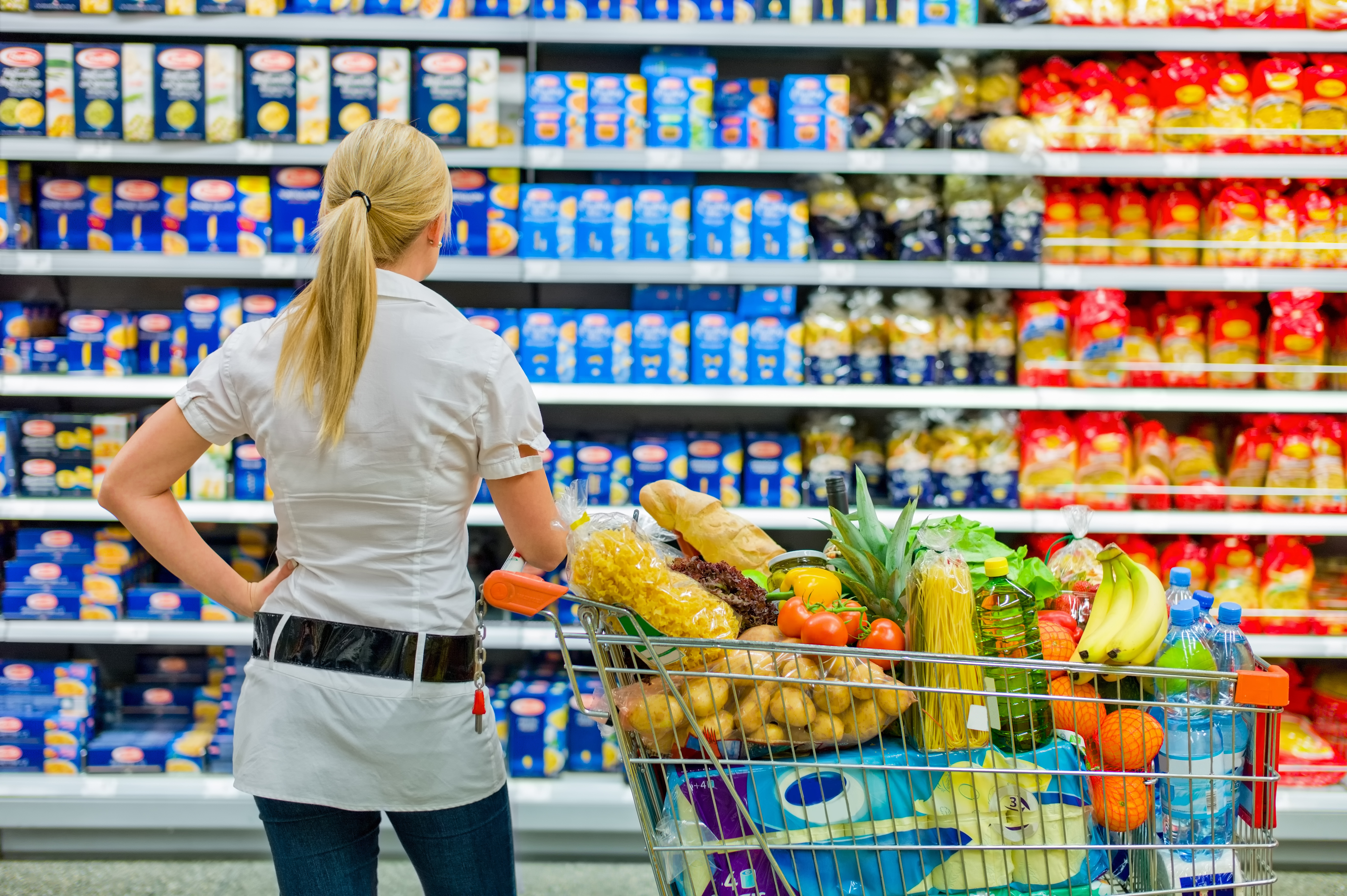 woman overwhelmed with wide range in supermarket