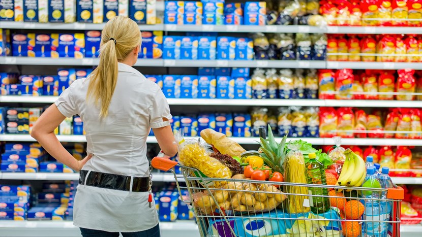 woman overwhelmed with wide range in supermarket