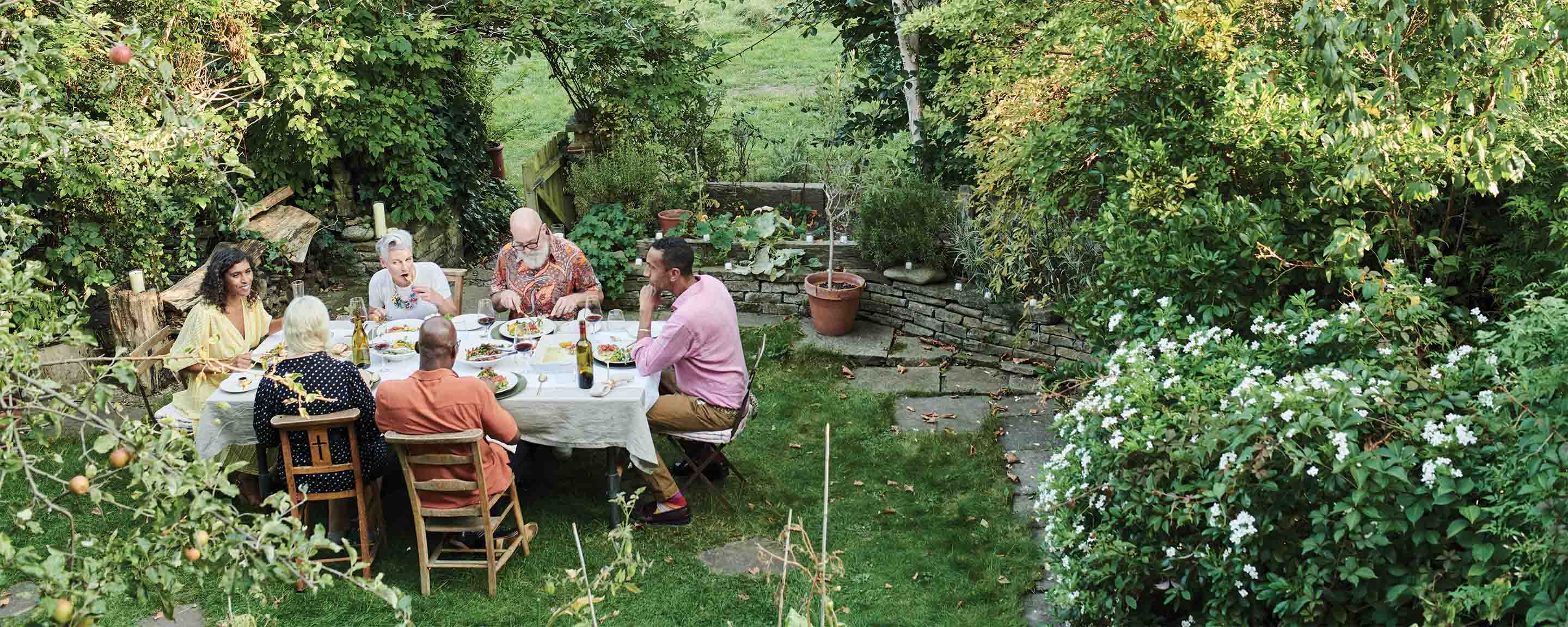 Friends dining outside on a warm summers day